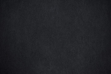 Abstract black fabric texture background or dark grey cloth texture background with vignette effect