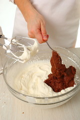 Making filling. Add chocolate mixture into whipped cream until just combined. Making Chocolate Hazelnut Meringue Cake.