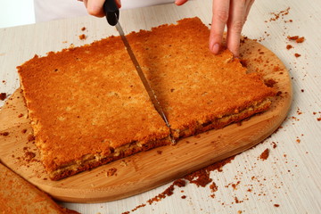 Assemble. Cutting meringue into rectangles. Making Chocolate Hazelnut Meringue Cake.