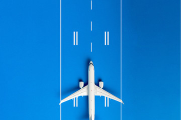 Travel Planning. Airplane on runway on blue background. Preparation for Traveling. Copy space,...