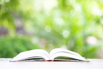 Open book with blurred background.