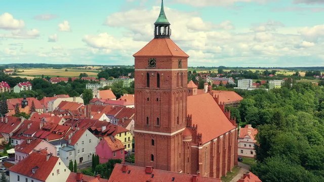 Aerial view on a little city with a clock tower by the church.