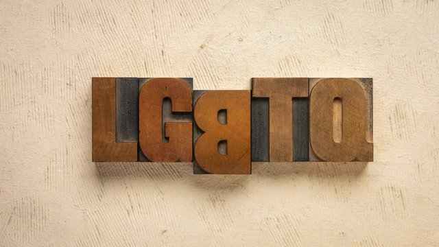 LGBTQ initialism for lesbian, gay, bisexual, transgender and queer. Stop motion animation in vintage letterpress wood type blocks. Diversity of sexuality and gender identity-based cultures concept.