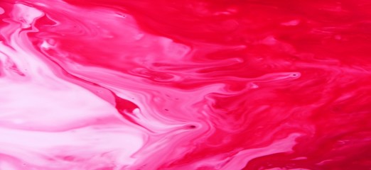 Pink and red marble abstract background. Natural stone texture. Acrylic paint flows freely and...