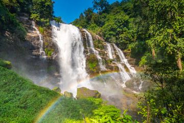 Fototapeta premium Wachirathan Waterfall at Doi Inthanon National Park, Mae Chaem District, Chiang Mai Province, Thailand. Fresh flowing water in tropical rainforest. Green trees, vibrant colors, tranquility
