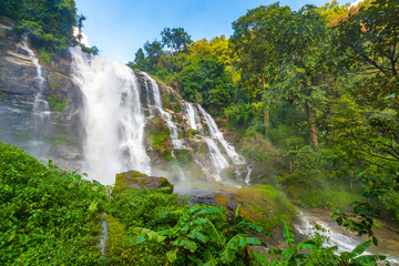 Wachirathan Waterfall at Doi Inthanon National Park, Mae Chaem District, Chiang Mai Province, Thailand. Fresh flowing water in tropical rainforest. Green trees, vibrant colors, tranquility