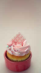 Girl's day sweets with butter cream and decor with caramel drops