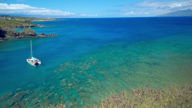 Landscape of Honolua Bay in Maui Hawaii. Honolua Bay located north of Kapalua, West Maui Hawaiʻi, United States. Snorkeling paradise coral reefs in marine preserve. Gimbal panning cinematic ProRes 422