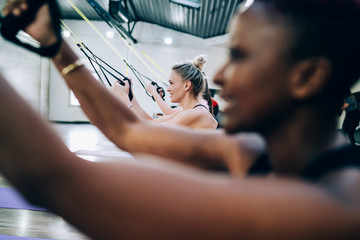 Multiracial women training with expanders