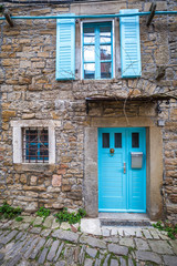 Stone facades of old houses in ancient streets. The Groznjan village on Istria in Croatia, Europe.