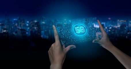 5G network digital hologram and internet of things on city background.Double exposure city of cpu 5g.5G network wireless systems,IoT(Internet of Things),communication network concept.