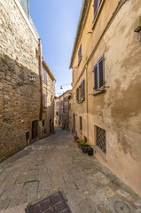 Fototapeta na wymiar Ancient and characteristic medieval alley in Tuscany