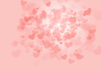 Pink hearts bokeh on pink background as a background for Valentine's Day.