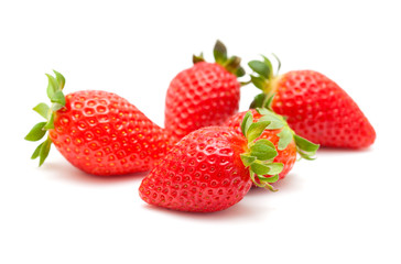 red ripe strawberries on white