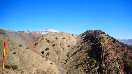Bright landscape of Morocco, breathtaking curves of mountains, stunning combination of hills & farm land,inadvertent distribution of houses & huts, raw impression of pure nature.
