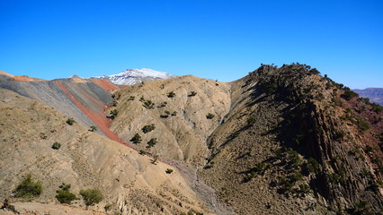 Bright landscape of Morocco, breathtaking curves of mountains, stunning combination of hills & farm land,inadvertent distribution of houses & huts, raw impression of pure nature.