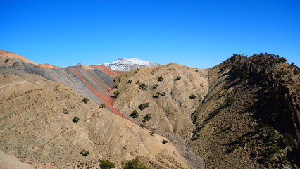 Bright landscape of Morocco, breathtaking curves of mountains, stunning combination of hills & farm land,inadvertent distribution of houses & huts, raw impression of pure nature.