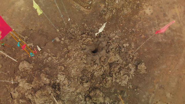 Ascending aerial footage of an active mud volcano located in Piparo, Trinidad and Tobago