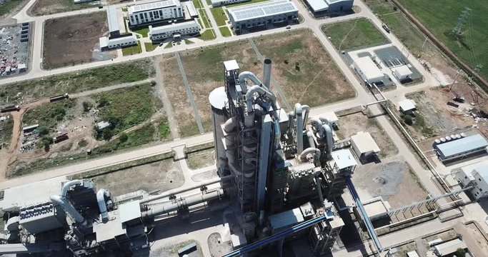 Aerial circle shot around huge industry manufactory zone in Cambodia,big cement factory