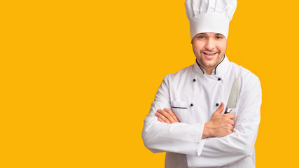 Cook Guy Holding Kitchen Knife Standing Over Yellow Background, Panorama