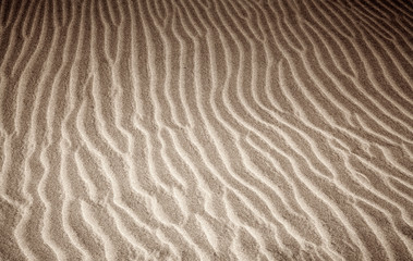 sand and wind pattern on dunes