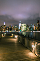 Fototapeta na wymiar Blurred view on Midtown Manhattan from the pier