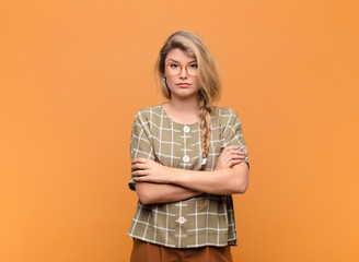  feeling displeased and disappointed, looking serious, annoyed and angry with crossed arms