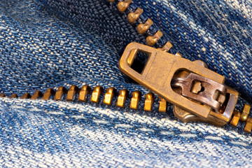 Open zipper of a worn out jeans