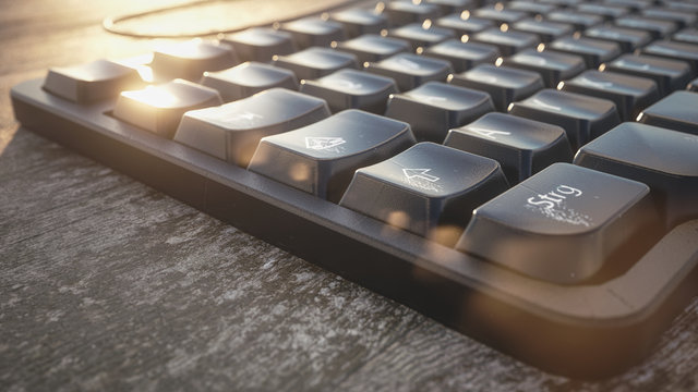 pc keyboard on a table with worn natural wood - 3D Rendering
