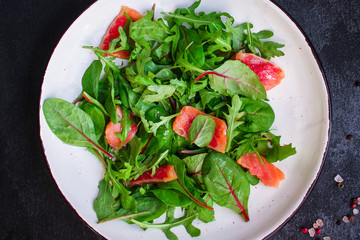 healthy salad leaves mix, salmon or tuna (delicious snack) menu concept. food background. top view. copy space
