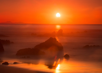 red sunset on a wild beach