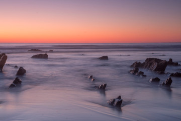 sunset on the beach in barrika, basque country