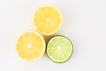 Fresh slices of orange lime on a white background.