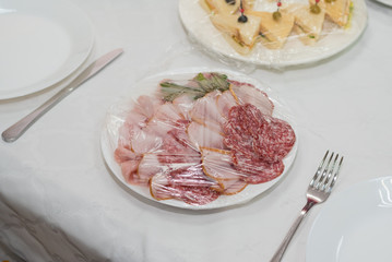 Catering for a banquet. Delivery of servings of food in packaging directly to the table.