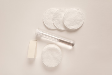 Concept of care face with micellar water and cotton pad top view. Hygiene for skin.