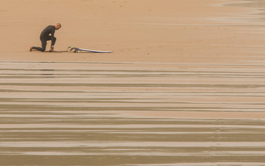 Surfer in sopelana in basque coast, Spain
