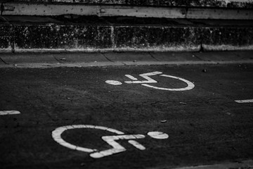 black and white asphalt disability sign