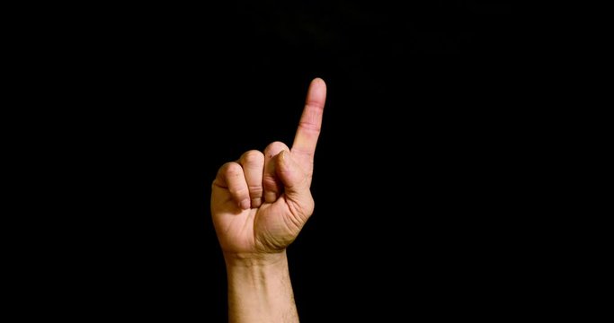 Male hand showing the number one on black background
