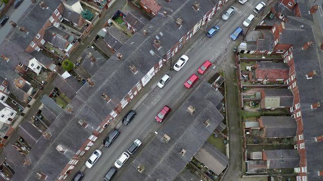 Overhead aerial footage of terrace housing in one of Stoke on Trent's poorer areas, poverty and urban decline, council and social housing, West Midlands