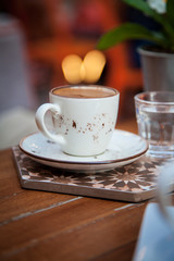 Caffee on table and blured cafe