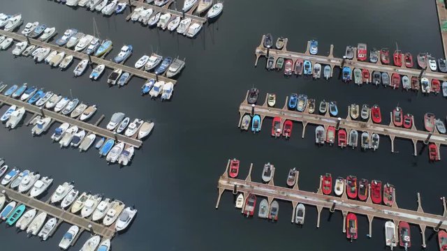 Aerial view of boats at the port of Ferrol, Galicia on a cloudy day, pan left