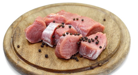 Fresh raw beef meat slices isolated over white background
