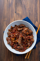 meat with vegetables in white bowl