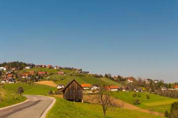 Landscape with green field and blue sky
