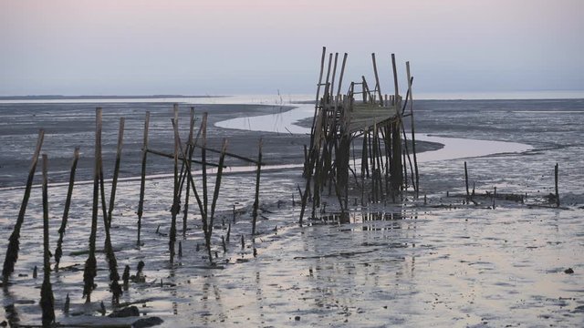 Carrasqueira Palafitic Pier in Comporta, Portugal at sunset