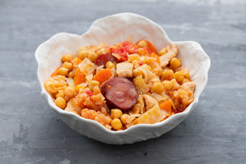 chick pea with cabbage, carrot and smoked sausages in beautiful bowl