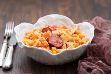 chick pea with cabbage, carrot and smoked sausages in beautiful bowl