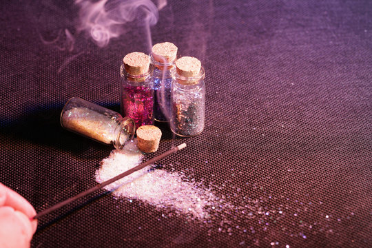 Glass bottles photographed in the studio with colored foils before the flashes