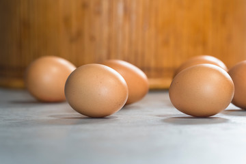 A few brown eggs on a table