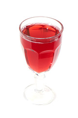 Glass of red wine on a wooden table. Isolated.